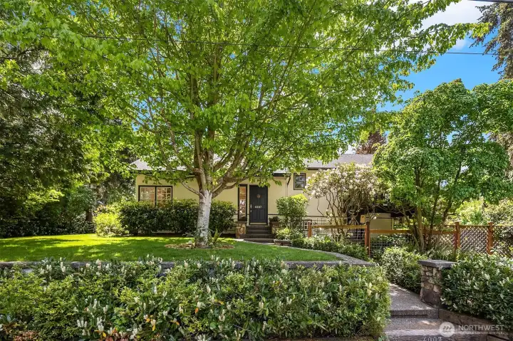Set back from the road, this home enjoys a lush, private setting.