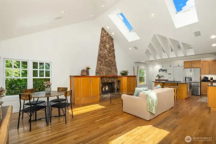 Light, lofty interiors live large with an open layout & cathedral ceilings.