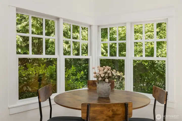 Dine alongside garden views through wrap-around windows.