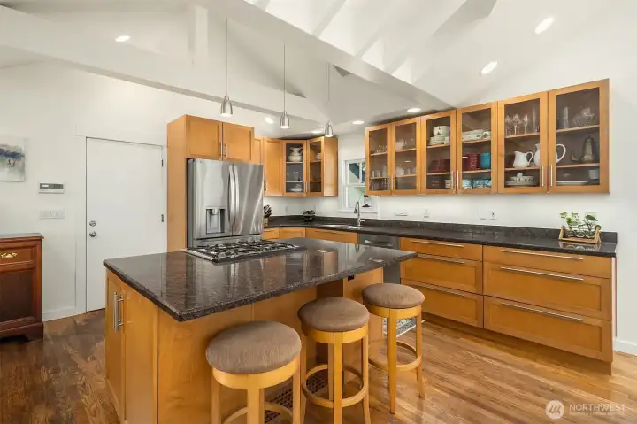 Treat the chef to slab granite surfaces & stainless-steel appliances.