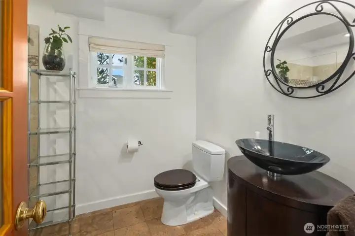 Downstairs bathroom with vessel sink & shower.
