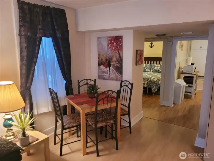 1221B -Dining nook with view to kitchen and bedroom