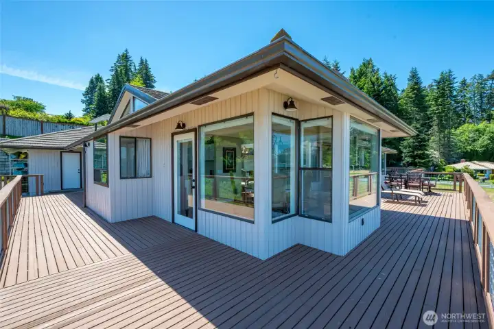 Deck wraps around three sides of the main level.