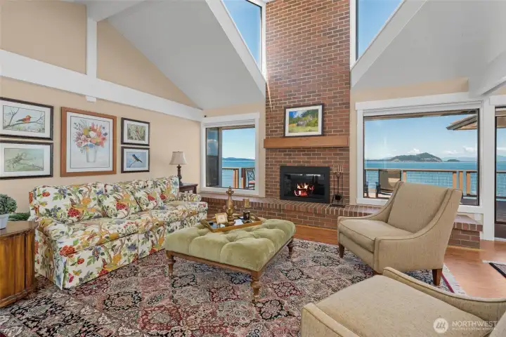 Living room with exposed beams and skylights.