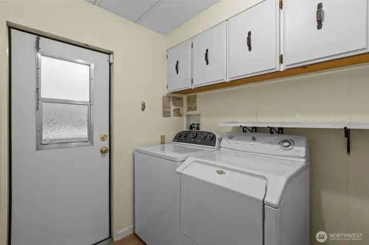 Utility room with washer and dryer