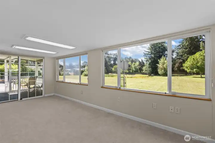 Enclosed sunroom to enjoy the view!