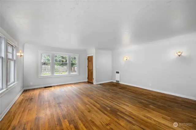 This is looking back at the entry, wonderful wood floors and large windows.