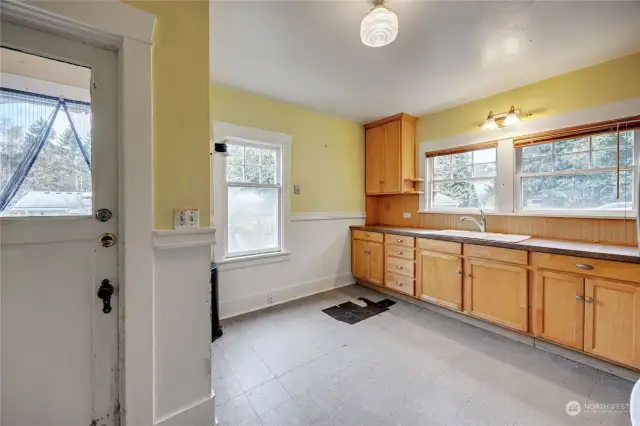 Bright sunny kitchen and the door to the back yard.