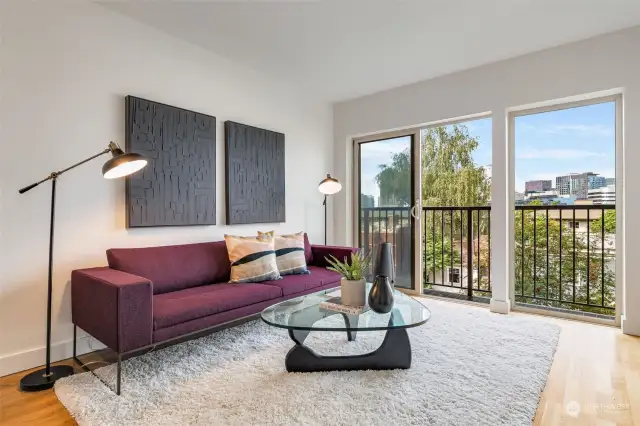 Light-filled West facing unit with city view  balcony.