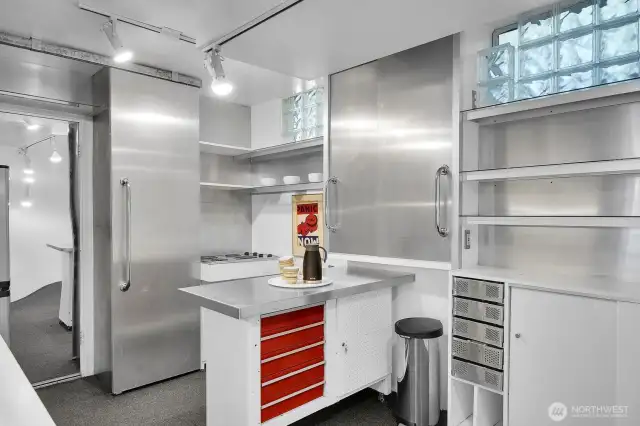 Lower level 2nd kitchen with direct access to the backyard.