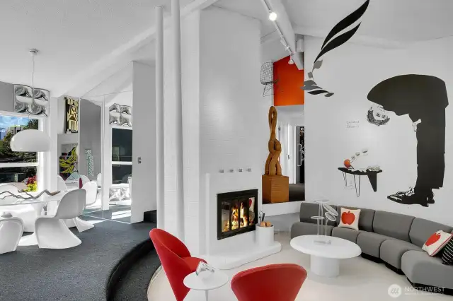 Great room with a traditional sunken living room and abundance of natural light for great entertaining.