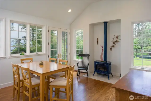 Kitchen/family room with enamel propane stove and French doors to the entertainment deck.