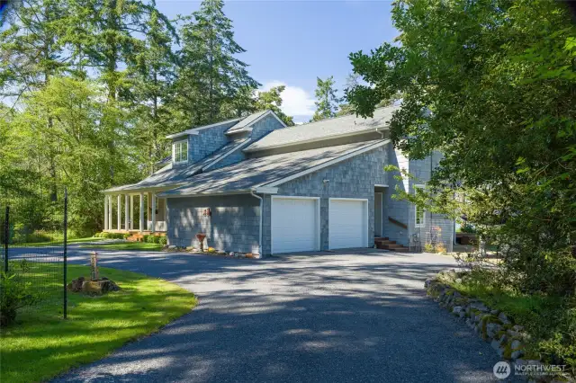 Two car attached garage and newly finished driveway surface.