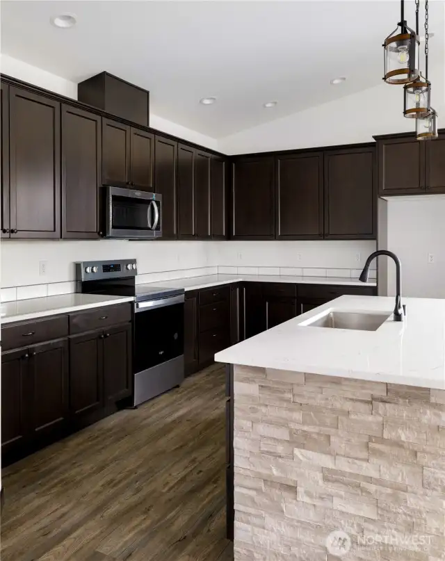 Photo of a similar home in the neighborhood by the same builder