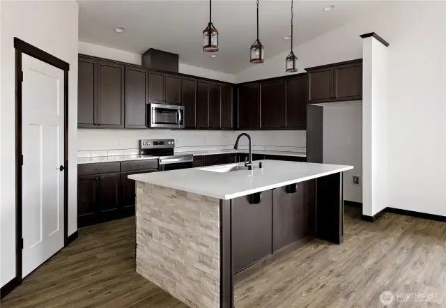 Photo of a similar home in the neighborhood by the same builder
