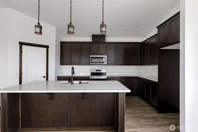 Photo of a similar home in the neighborhood by the same builder