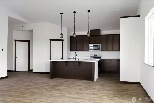 Photo of a similar home in the neighborhood by the same builder