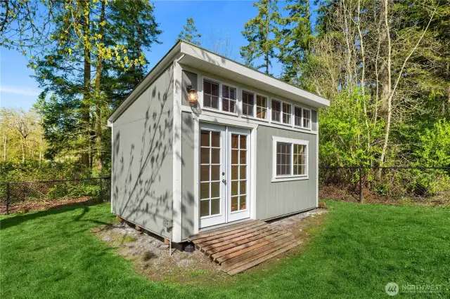 The art studio soars with natural light, this would also make a lux  potting shed.