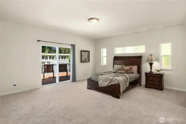 The primary suite is huge and opens to the deck and hot tub.