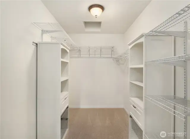 The walk in offers built-in shelving.