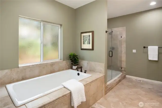 Unwind in the large soaking tub or large glass and tiled shower.