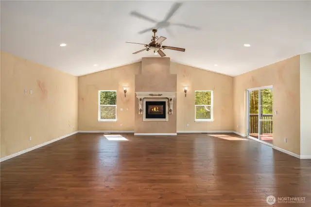 Cozy gas fireplace and hardwood floors are elegant and timeless.