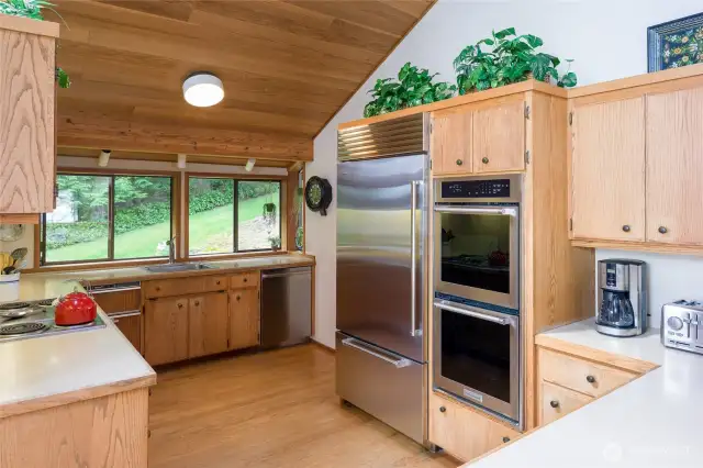 Very ample kitchen with walk in pantry just past the Sub Zero refrigerator.