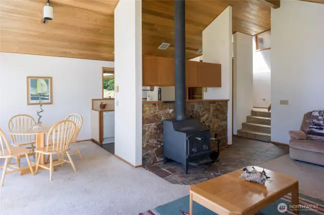 Looking toward eating area and kitchen.  Stairs to bedrooms and bathrooms.