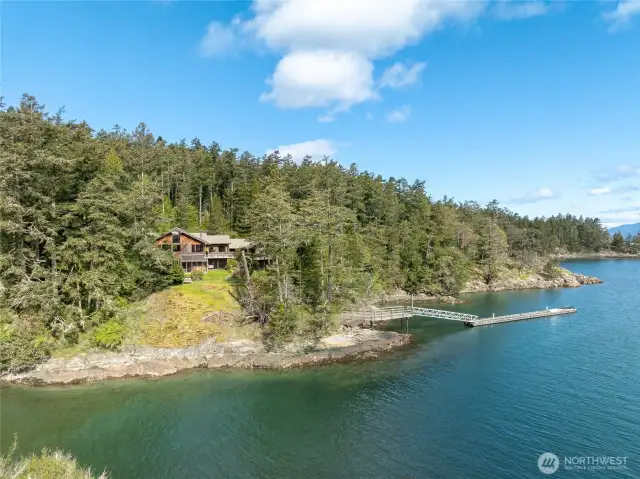 Rare, deep-water dock, two waterfront homes & buffered privacy from this 17+ acre island retreat.