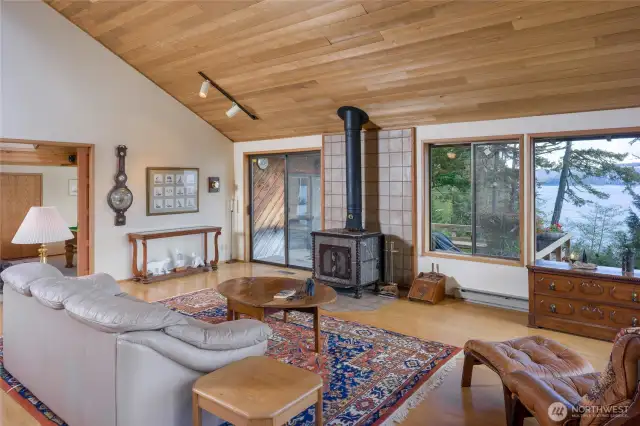 Another view of the Great Room with slider to the deck left of the wood stove.