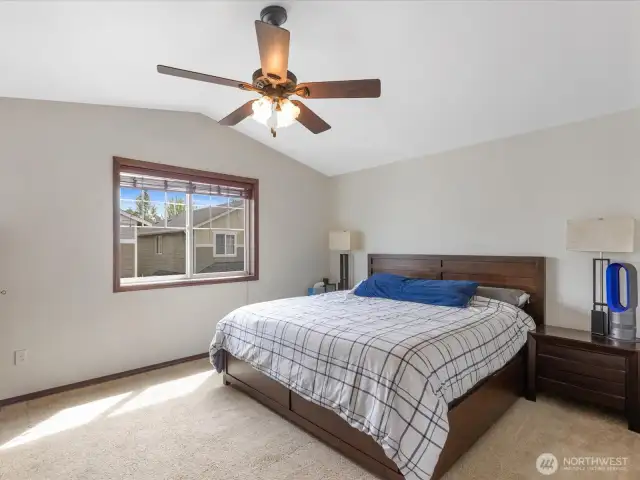 spacious primary with vaulted ceiling and full bath