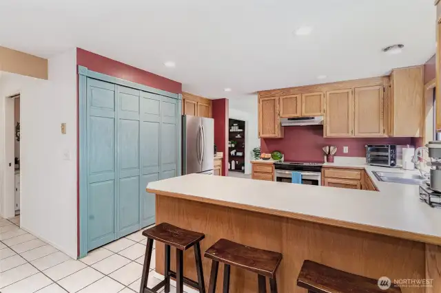 Kitchen has a big pantry and a breakfast bar