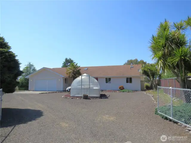 DRIVING INTO THE COURTYARD OF YOUR NEW 3 BEDROOM 2 BATH HOME ON THE BAYOU & GRAND CANAL! HOME IS COMPLETELY FENCED AND HAS A GREEN HOUSE FOR THE GARDENER!