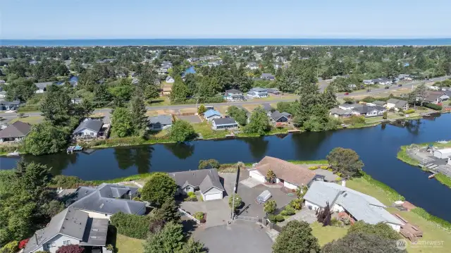 UP AND AWAY WITH VIEW OF THE HOME AND THE OCEAN IN THE BACKGROUND!