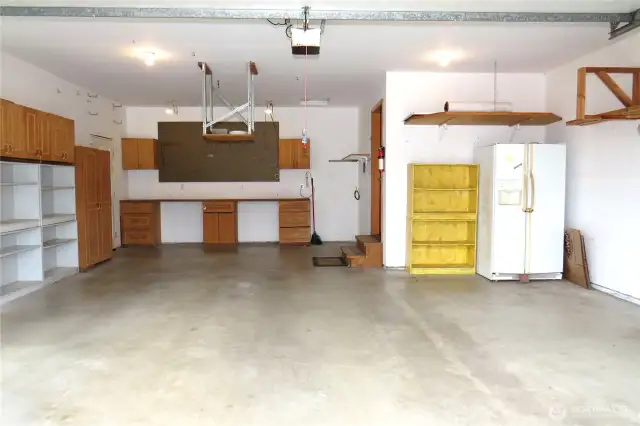 PLENTY OF PARKING IN THE GARAGE/SHOP!