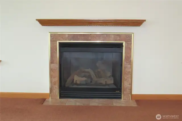 LIVING ROOM HAS A TILED PROPANE FIREPLACE FOR COOL BEACHY EVENINGS!