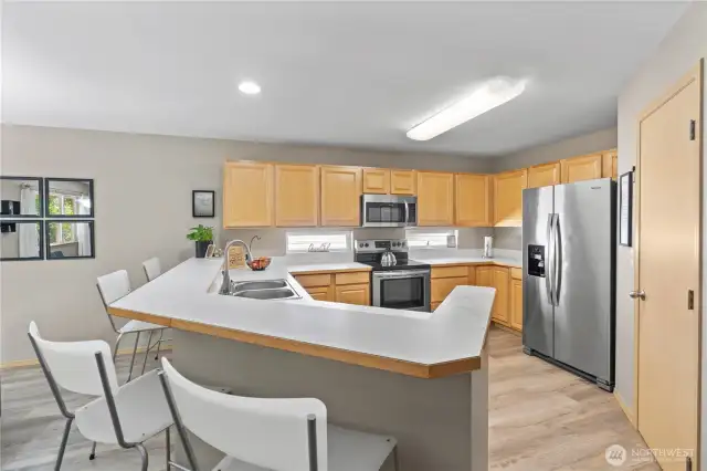 Highlights include stainless steel appliances, a center breakfast bar for casual meals, abundant counter space, and a pantry for all your storage needs.