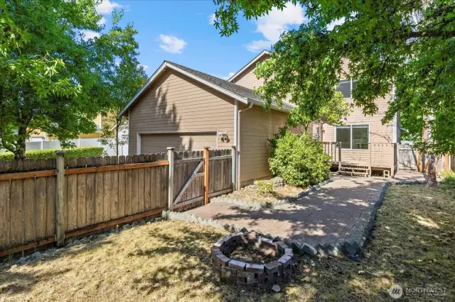 Nice sized backyard with bonfire pit.