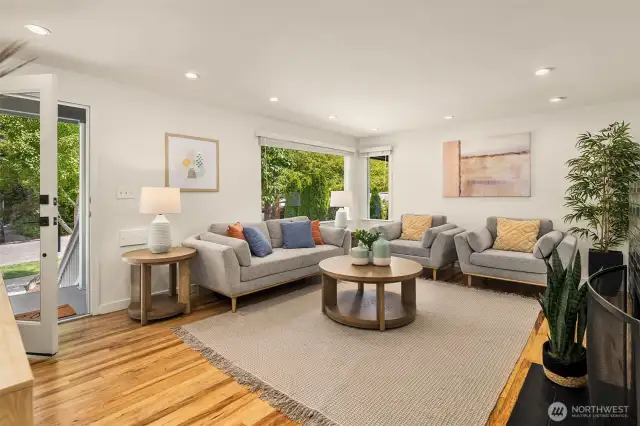 Living room with large windows allowing natural light to brighten the space.