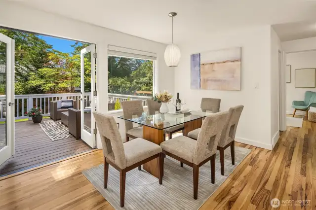 Dining area with French doors leading to private deck & backyard space.