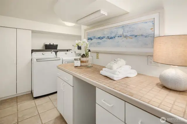 Laundry + utility area located in daylight basement.