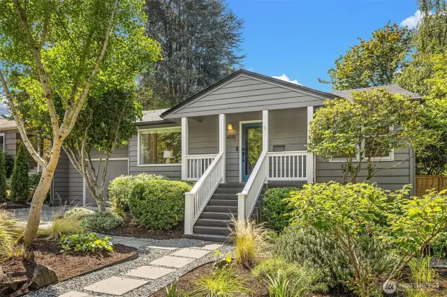 Inviting front entry with pavers leading to front steps & covered porch.