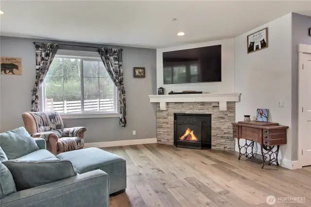 open floor plan living area with a cozy propane fireplace