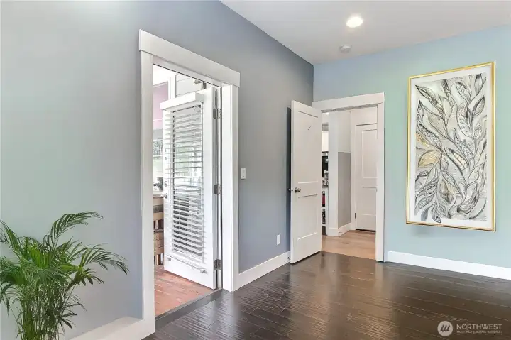 Door to covered porch from primary allows easy access to the hot tub !