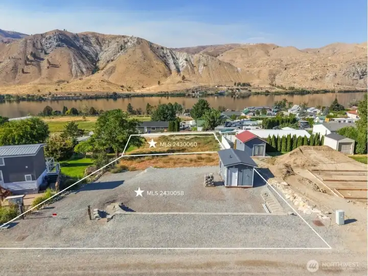 Additional lot for sale offered at $275,000 has 3 bedroom septic, water, power and 2 RV hook ups + shed with shower.
