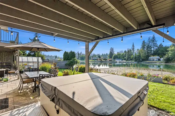 Patio with Hot Tub and Greenhouse