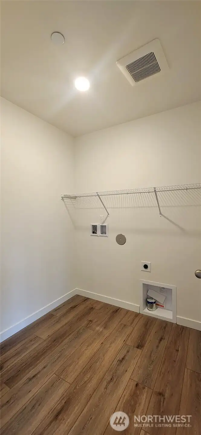 Laundry room conveniently located upstairs.