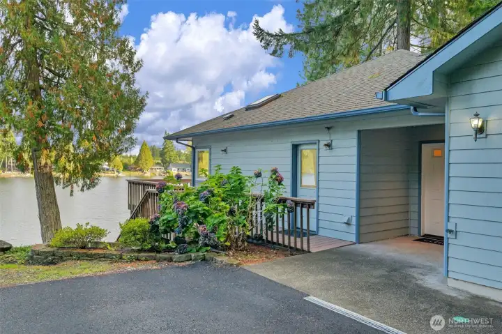 The driveway is newly laid asphalt, which makes it a dream to drive into this home
