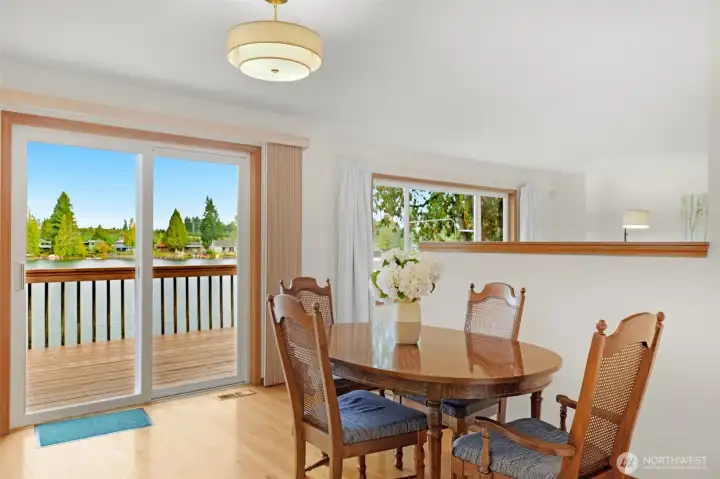 Views abound from each room on the main level.    The dining area also offers access to the deck overlooking the waterfront.