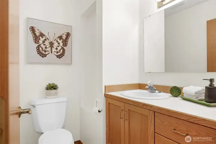 The powder room on the main level is located off the hallway.